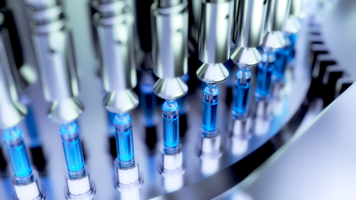 close up of laboratory machinery blue vials